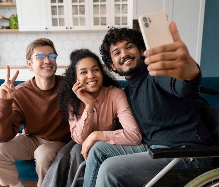A diverse group of people socialising at a community festival in a Perth